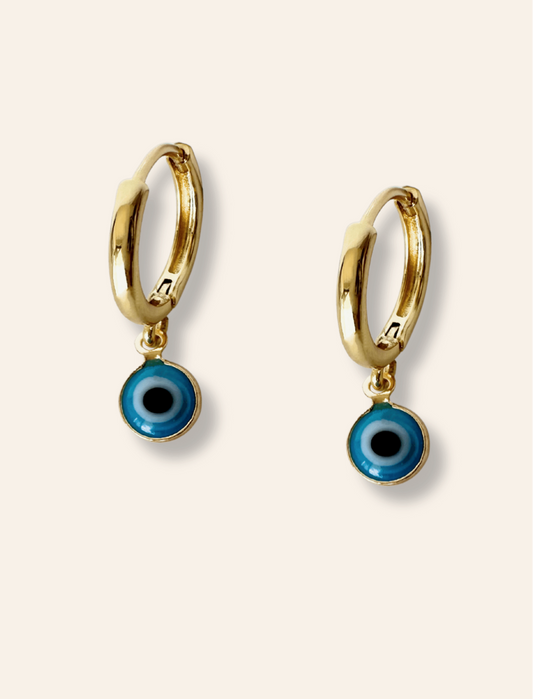 Evil eye hoops gold. Symbolic jewelry with evil eye gold