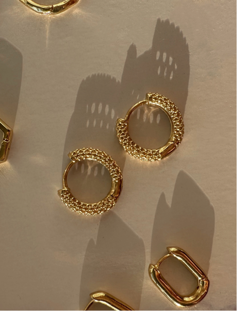 hailey bieber chunk gold hoops. summer jewelry trends