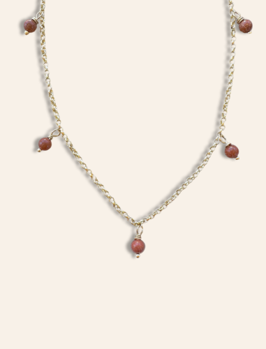 dainty gold necklace with hand wrapped goldstone pendants