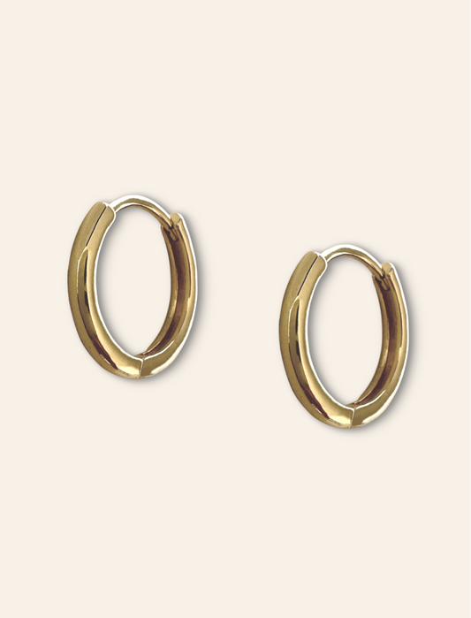 minimalist jewelry featuring an earring stack gold. Simple gold hoops