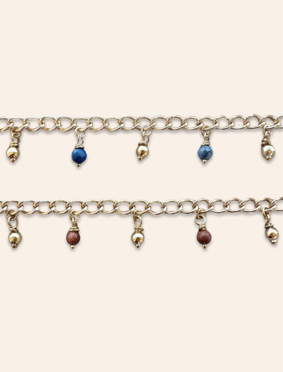 gold bracelet stack with dangle charms, gold charms, crystal charms, goldstone charms, lapis lazuli charms, rhodonite charms