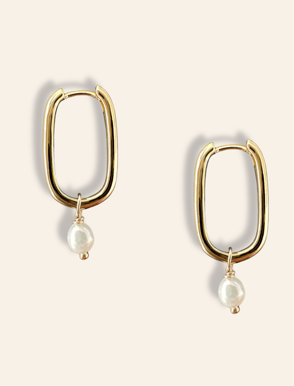 dainty rectangle pearl earrings in gold. Minimalist jewelry featuring gold drop hoops with small pearls