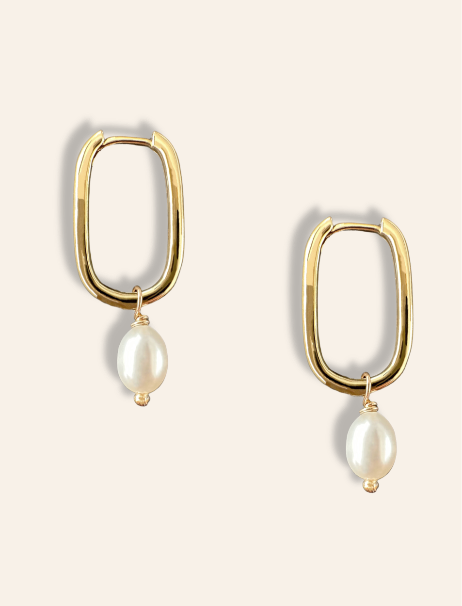 dainty rectangle pearl earrings in gold. Minimalist jewelry featuring gold drop hoops with pearls