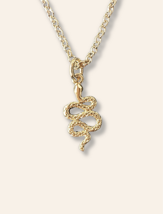 Dainty snake necklace pendant in gold. Necklaces designed to layer. Bycharlotte jewelry