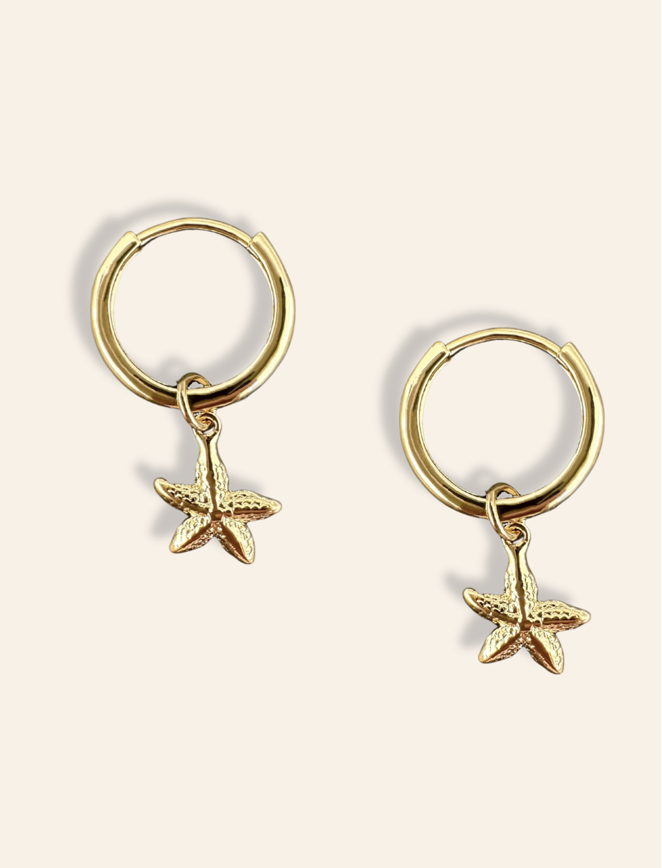 beachy jewelry featuring starfish earrings gold